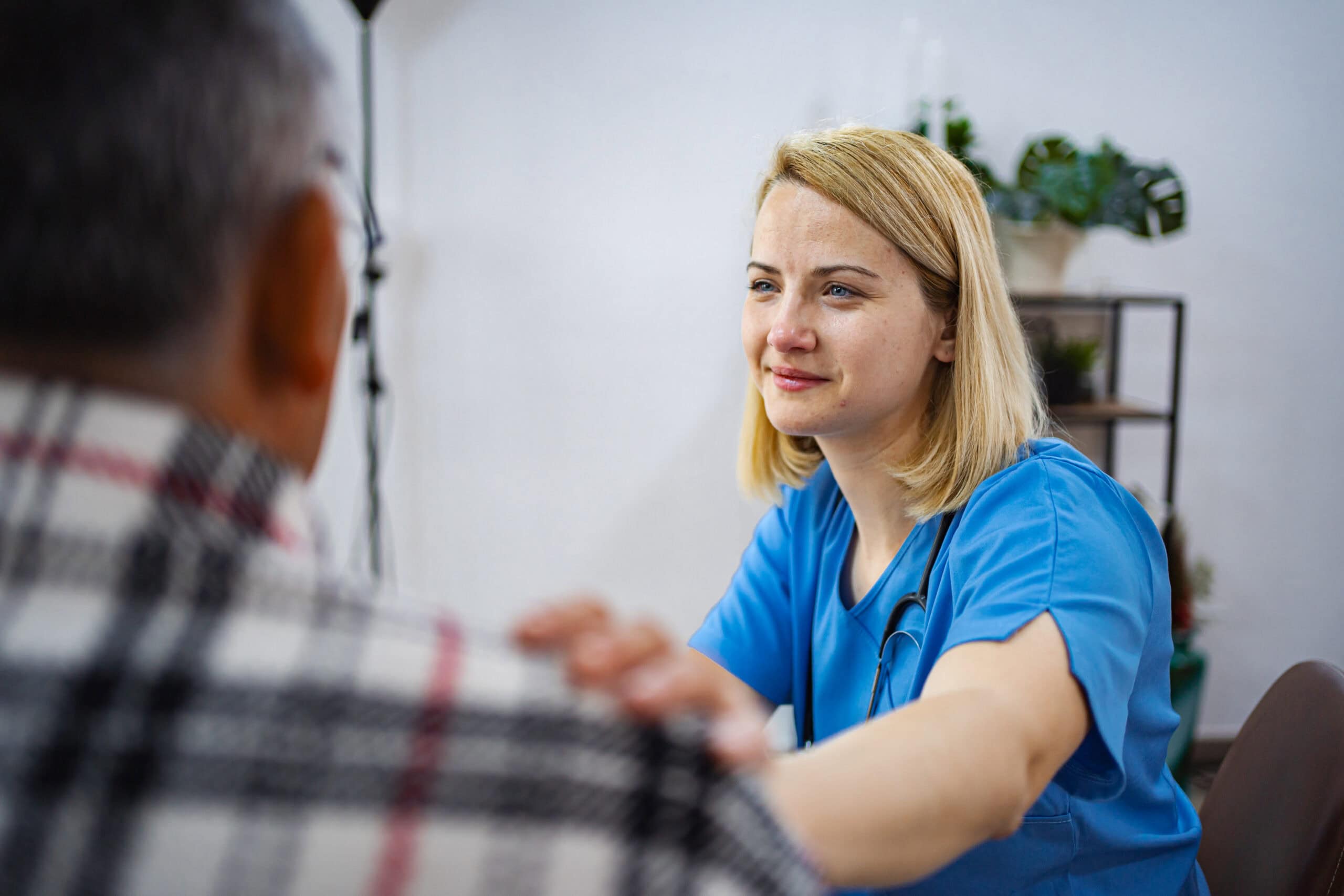 Medical expert provides attentive care during a visit.