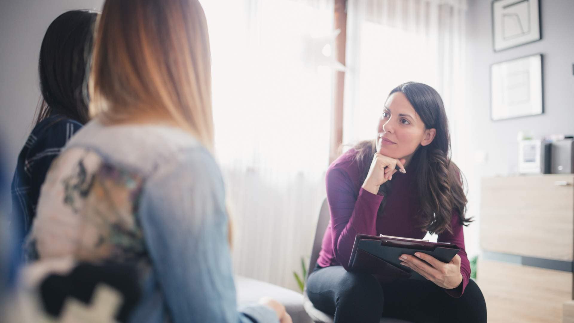 Group of individuals participating in Addiction and Mental Health Treatment in Englewood, CO, during a supportive counseling session at Ava Health.